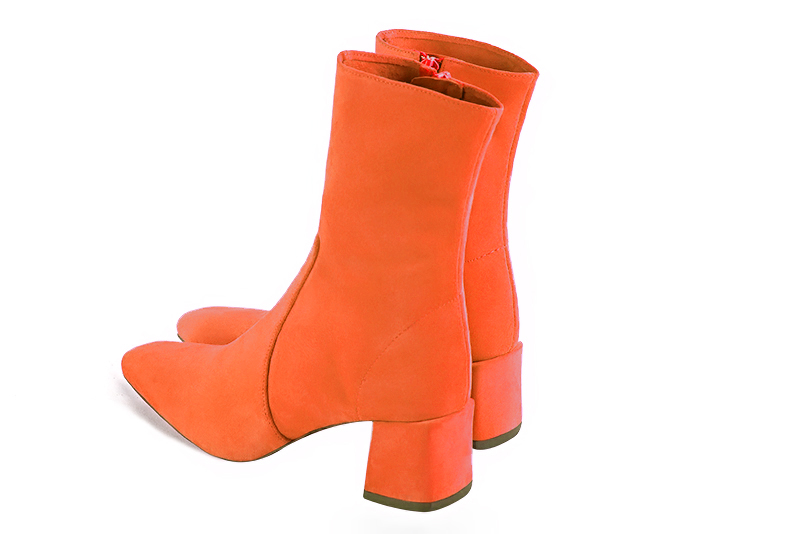 Clementine orange women's ankle boots with a zip on the inside. Square toe. Medium block heels. Rear view - Florence KOOIJMAN